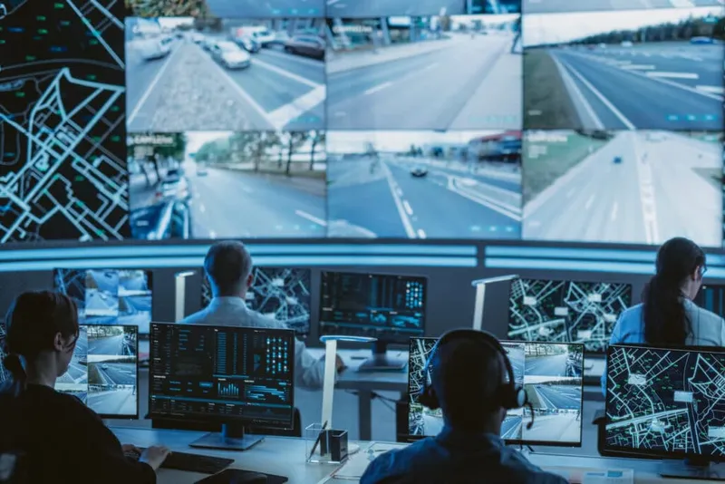 Traffic monitoring control centre with operators and screens