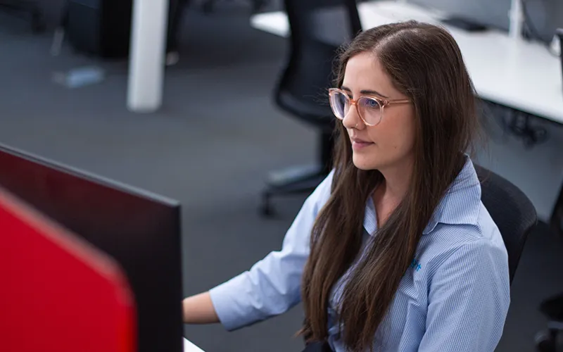 Jess working at the desk at
Addinsight.