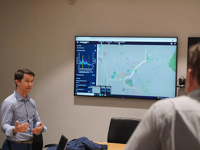 James Cox demonstrates the Addinsight platform to tour groups during an ITS event in 2022