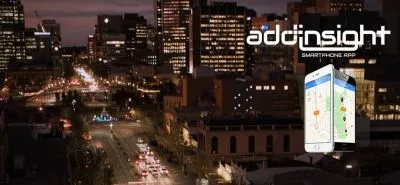Smartphones showing the Addinsight smartphone app overlaid on a photo of the Adelaide CBD