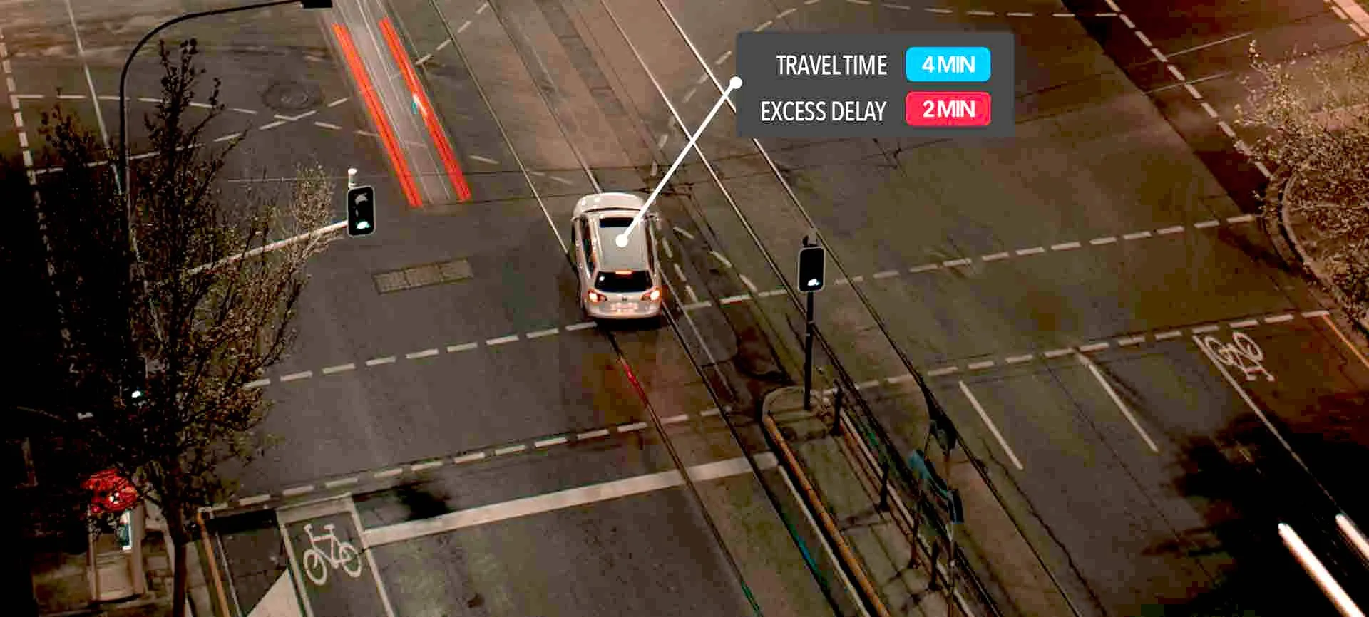 Car at intersection with travel time and delay overlay